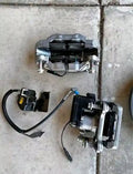OEM GMC 1500 Sierra 2022-2026 Brake Calipers, Brake rotors, backing plate, bolts, and brake hoses.