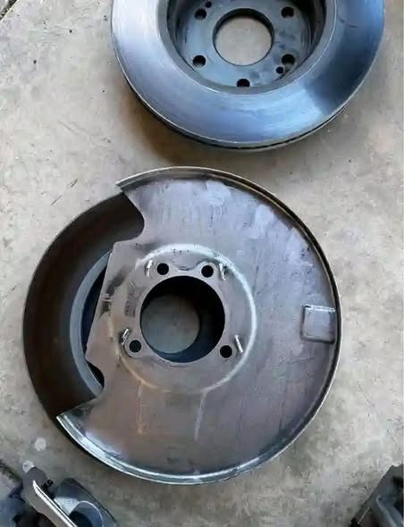 OEM GMC 1500 Sierra 2022-2026 Brake Calipers, Brake rotors, backing plate, bolts, and brake hoses.